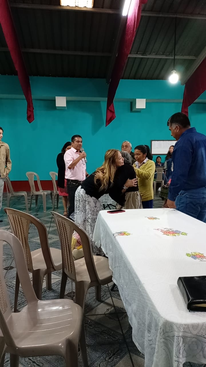 Monica embracing a community member at a Hands of Love gathering